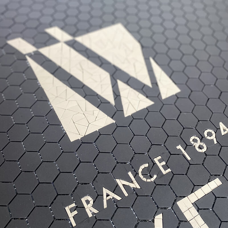 The art of mosaic by Chifoumi hexagonal tiles with lettering Winckelmans